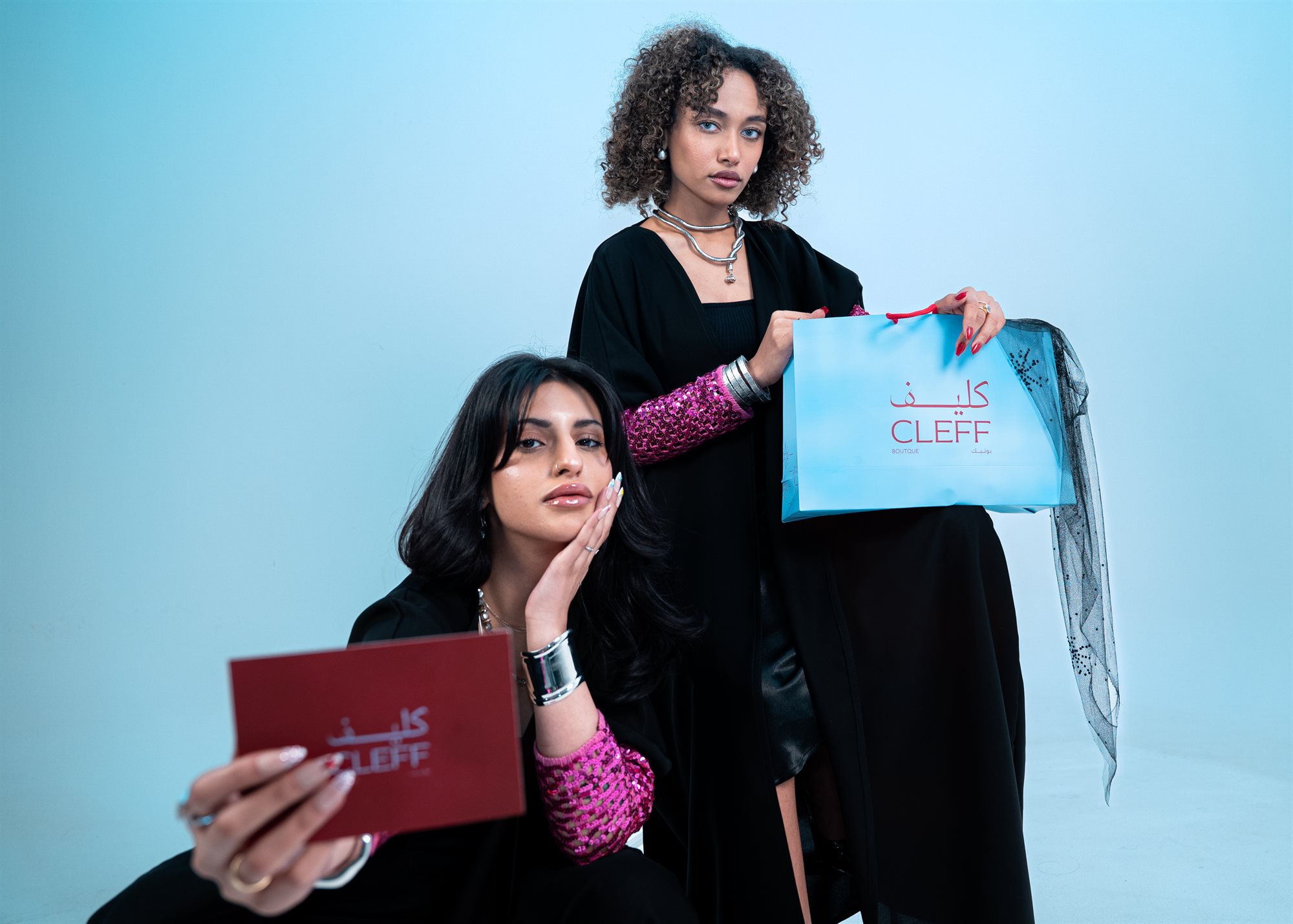 Cleff Boutique, two models with the brand bag