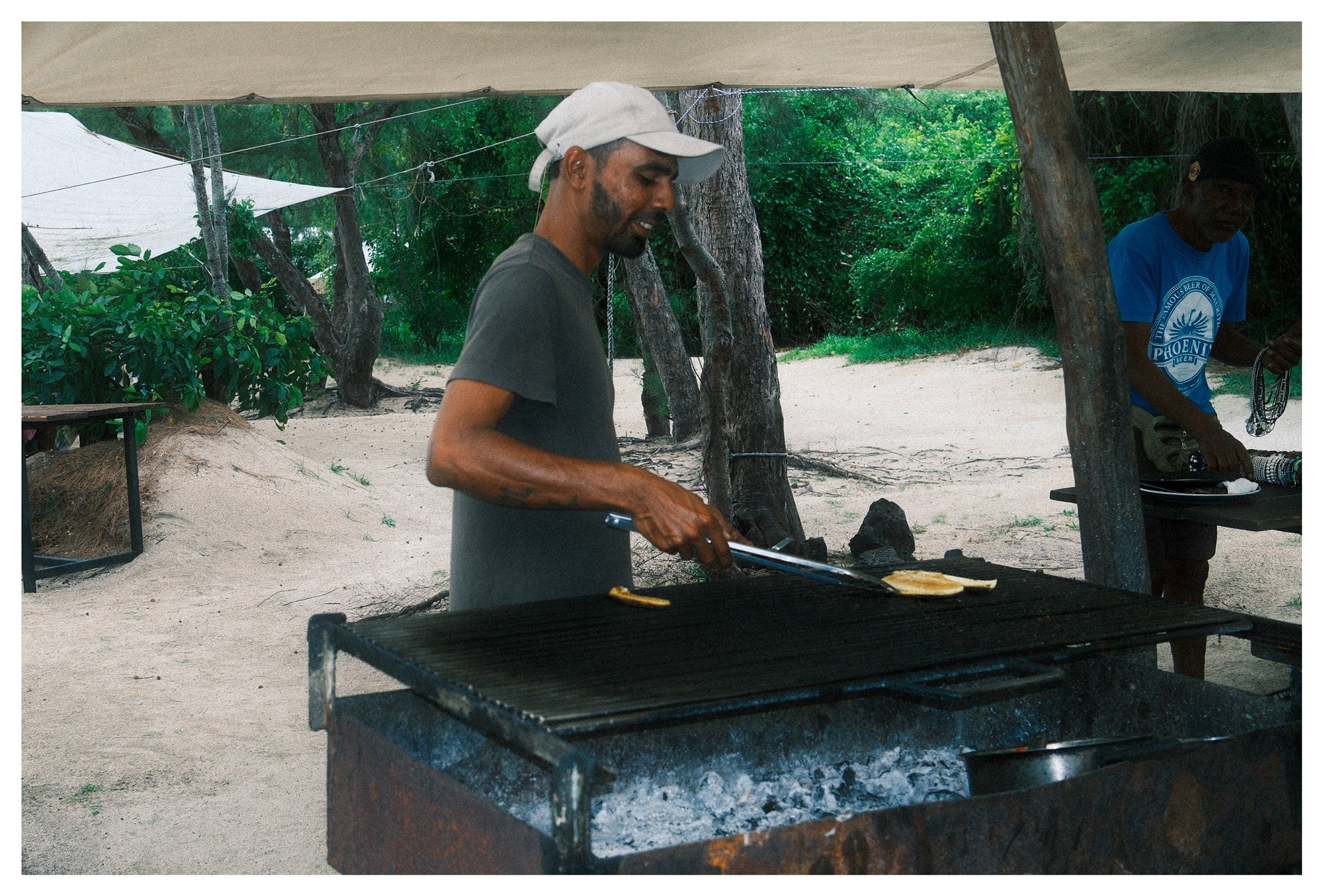 Mauritius, a man grilling food outdoors
