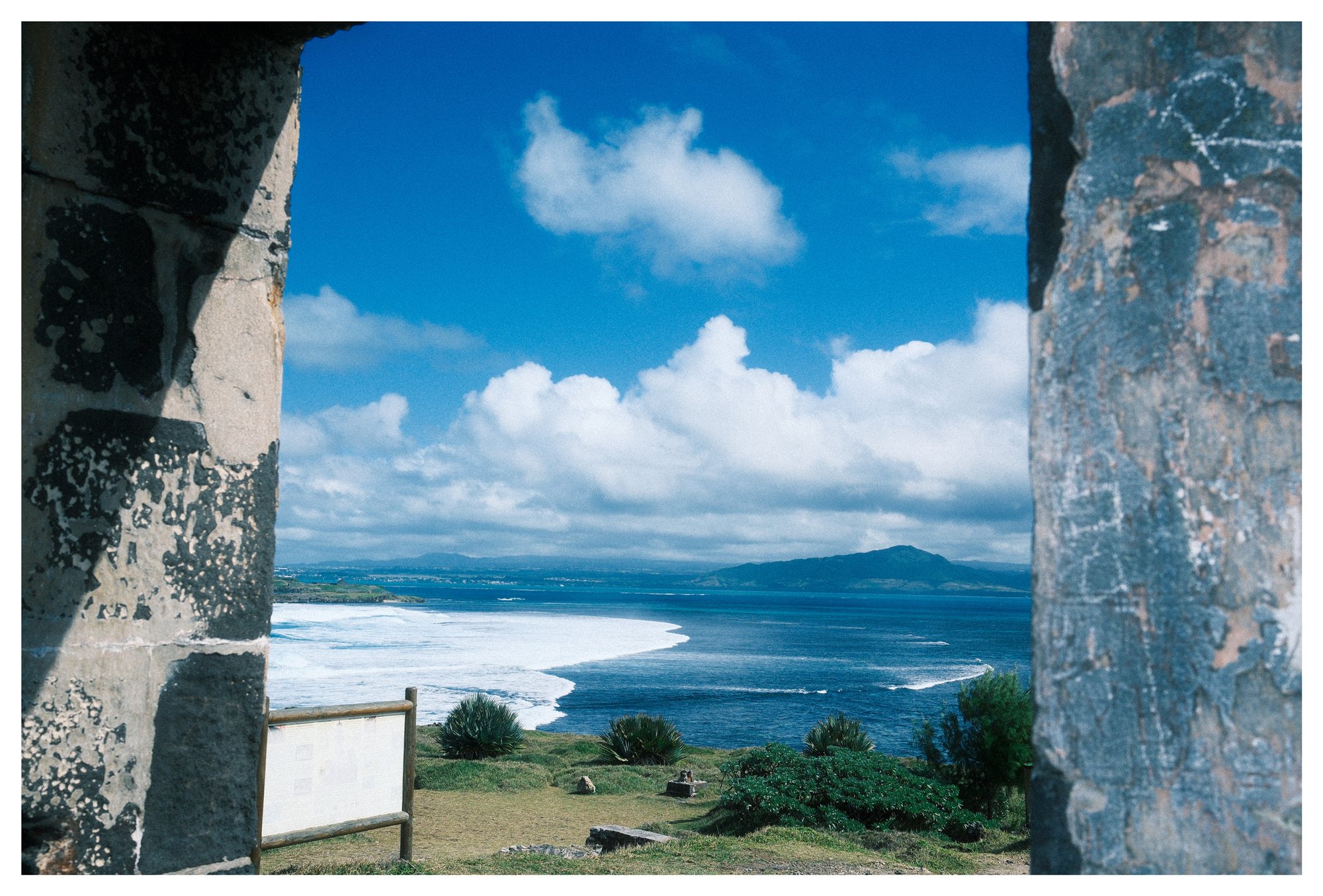 Mauritius, the sea framed between two weathered stone walls